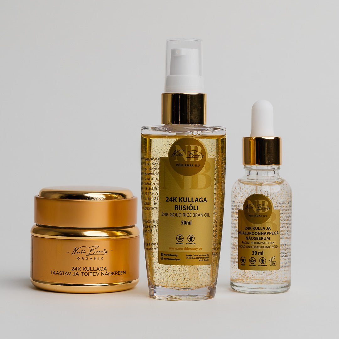 24K Gold Gift Set med tre gyllene hudvårdsprodukter: guldkräm i burk, risolja i sprayflaska och serum med pipett