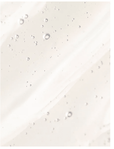 AHA Peeling Concentrate med syrlor som bubblor på ljus hudton, visar exfolierande effekt av kemisk peeling