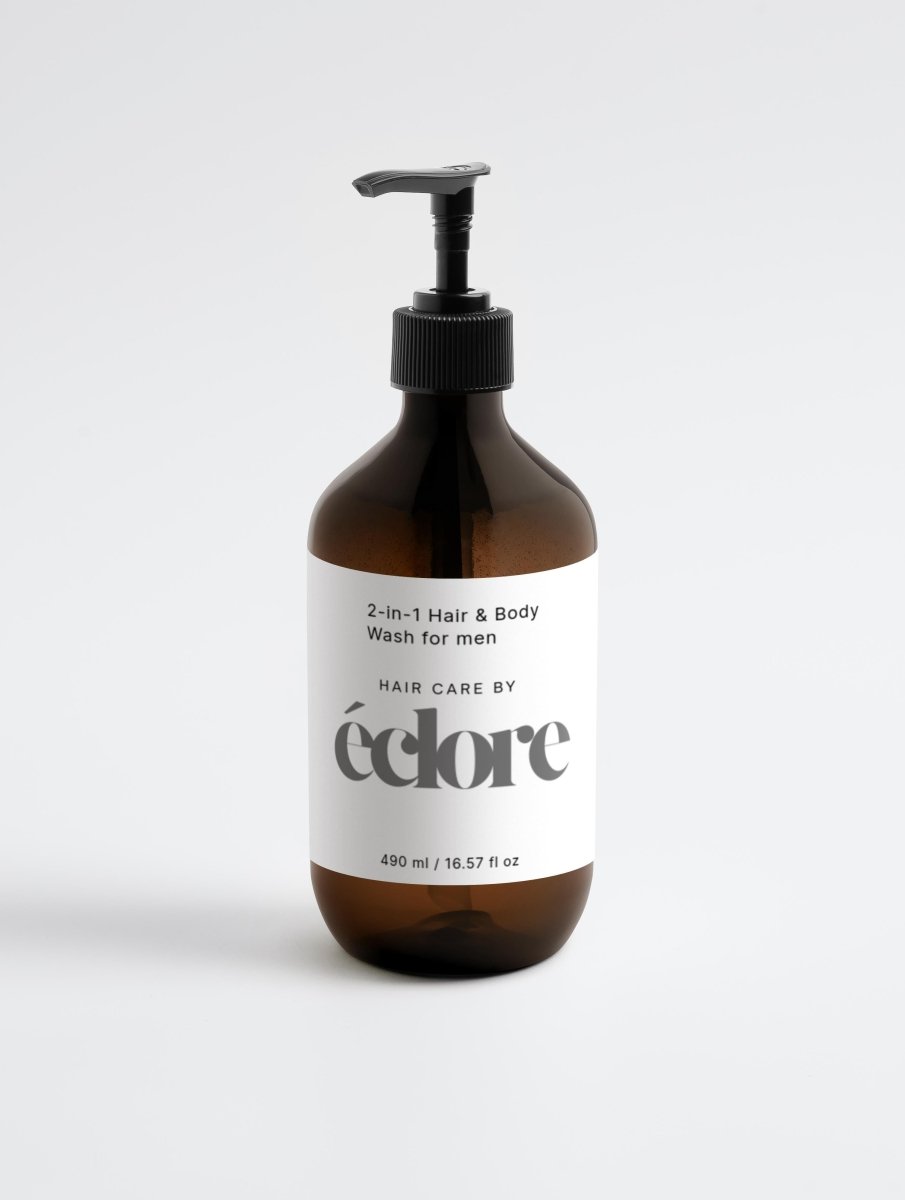 Brun glasflaska med pump och vit etikett för 2-in-1 Hair & Body Wash for men från éclore, 490 ml