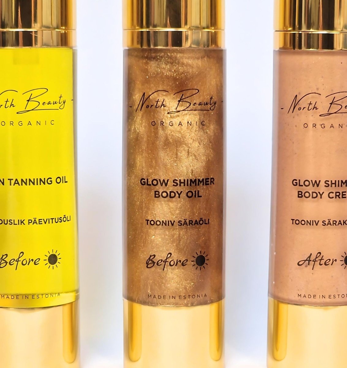Gyllene flaska med Glow Shimmer Body Oil från North Beauty Organic med guldpartiklar och pumpmunstycke