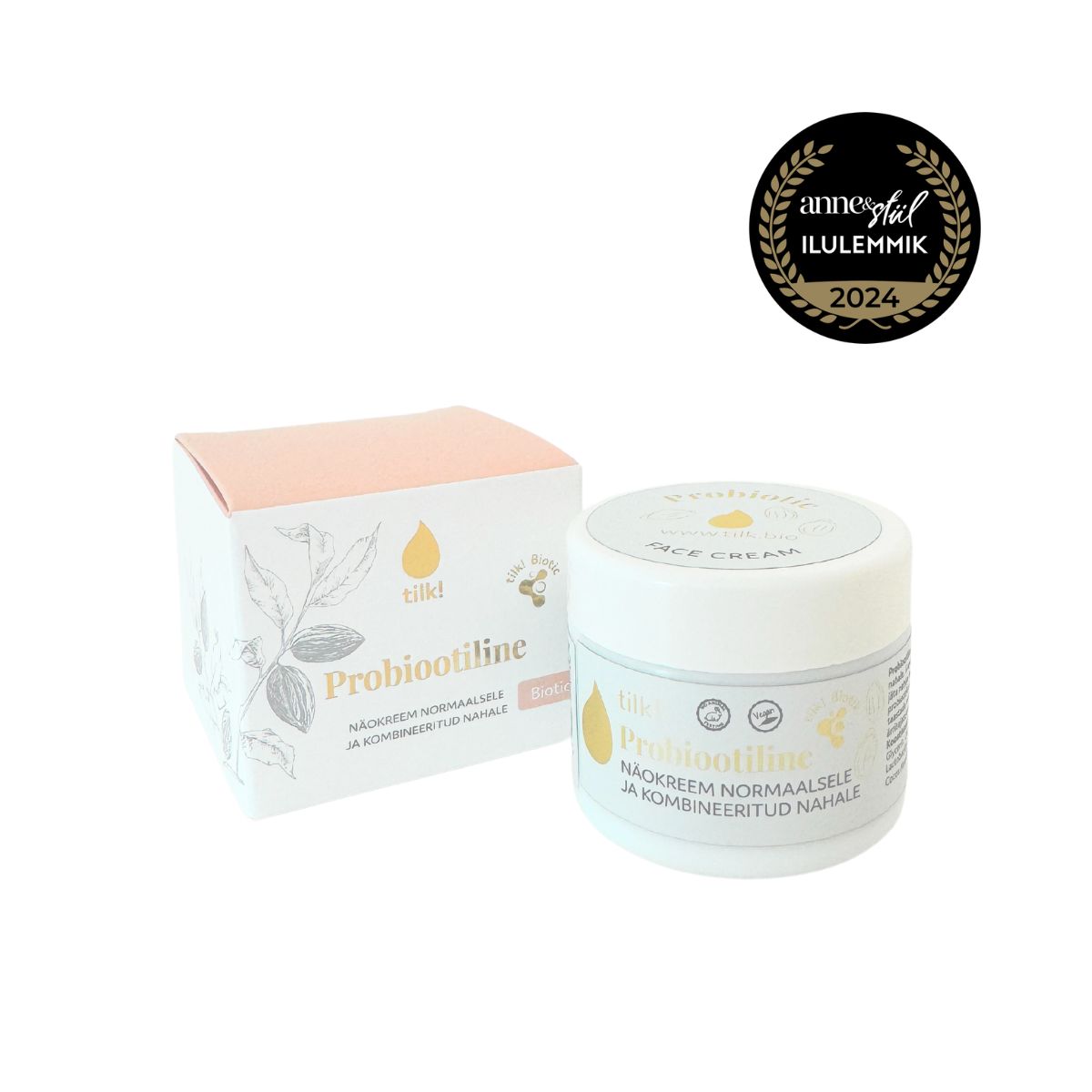 Probiotic Face Cream i vit burk med rosa lock bredvid vit förpackning med botaniska illustrationer