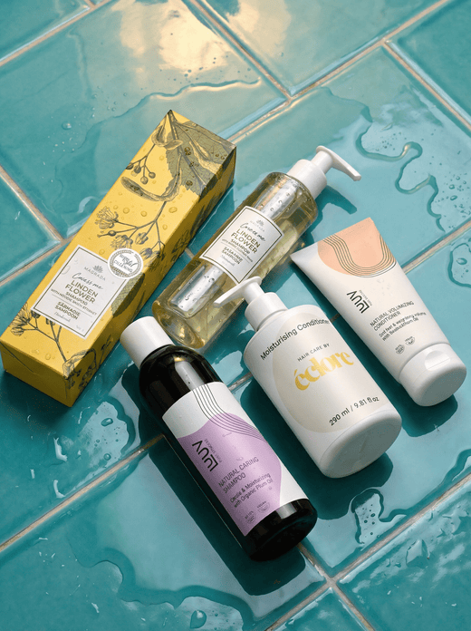 Schampo och balsam från éclore - Naturlig hårvård från LUUV och linden flower soap på våta kakelplattor