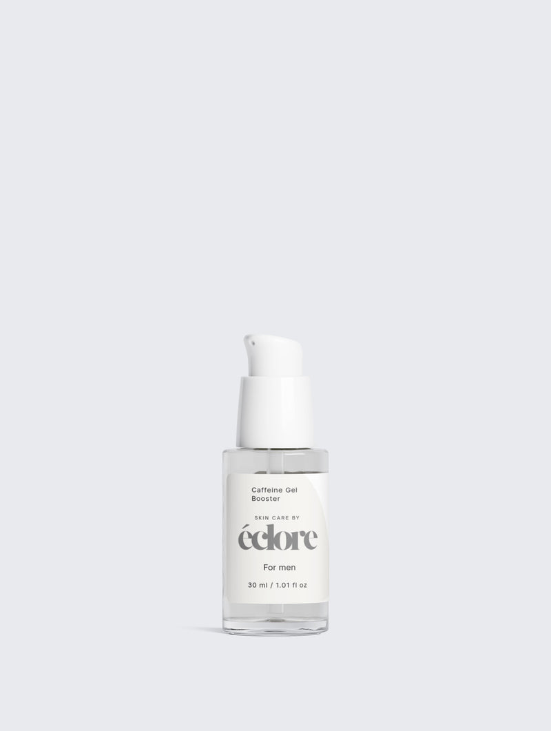 Vit glasflaska med pump som innehåller Caffeine Gel Booster 30ml från éclore, fotograferad mot ljus bakgrund