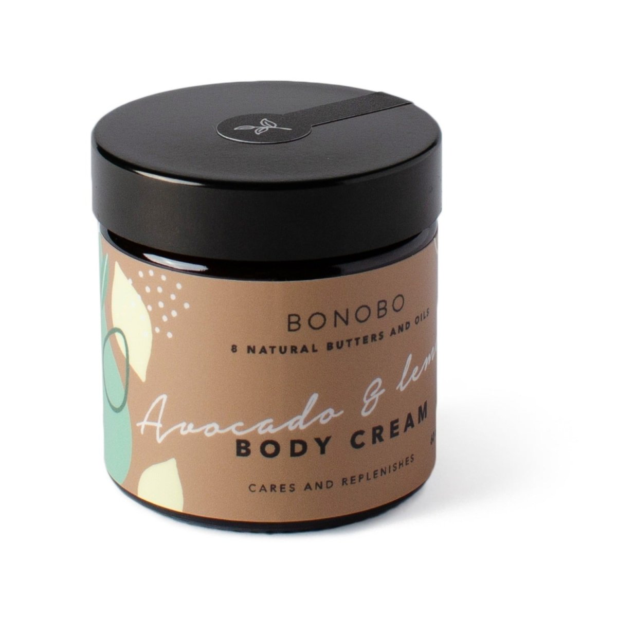 Rund glasburk med svart lock innehållande Bonobo Body Cream Avocado & Lemon med beige etikett och gröna designelement