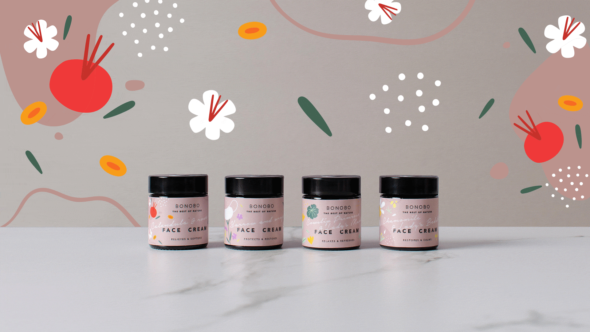 BONOBO ansiktskräm i rosa burk med svart lock, del av fyra produkter mot blommig bakgrund