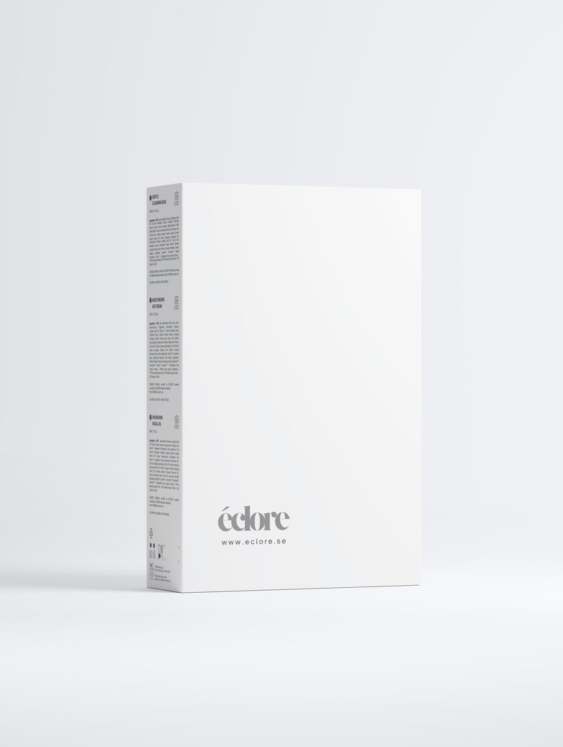 Vit elegant förpackning av Glowy Skin Trio Collection Box med éclore-logotype och produktinformation på sidorna