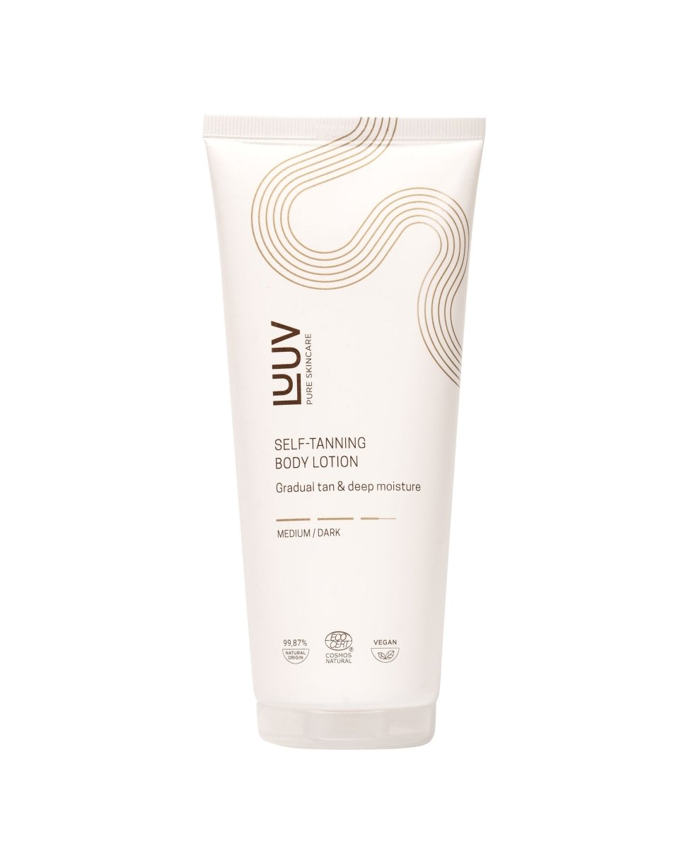 LUV Pure Skincare Self-Tanning Body Lotion Medium/Dark i ljusrosa tub med guldiga våglinjemönster och pump