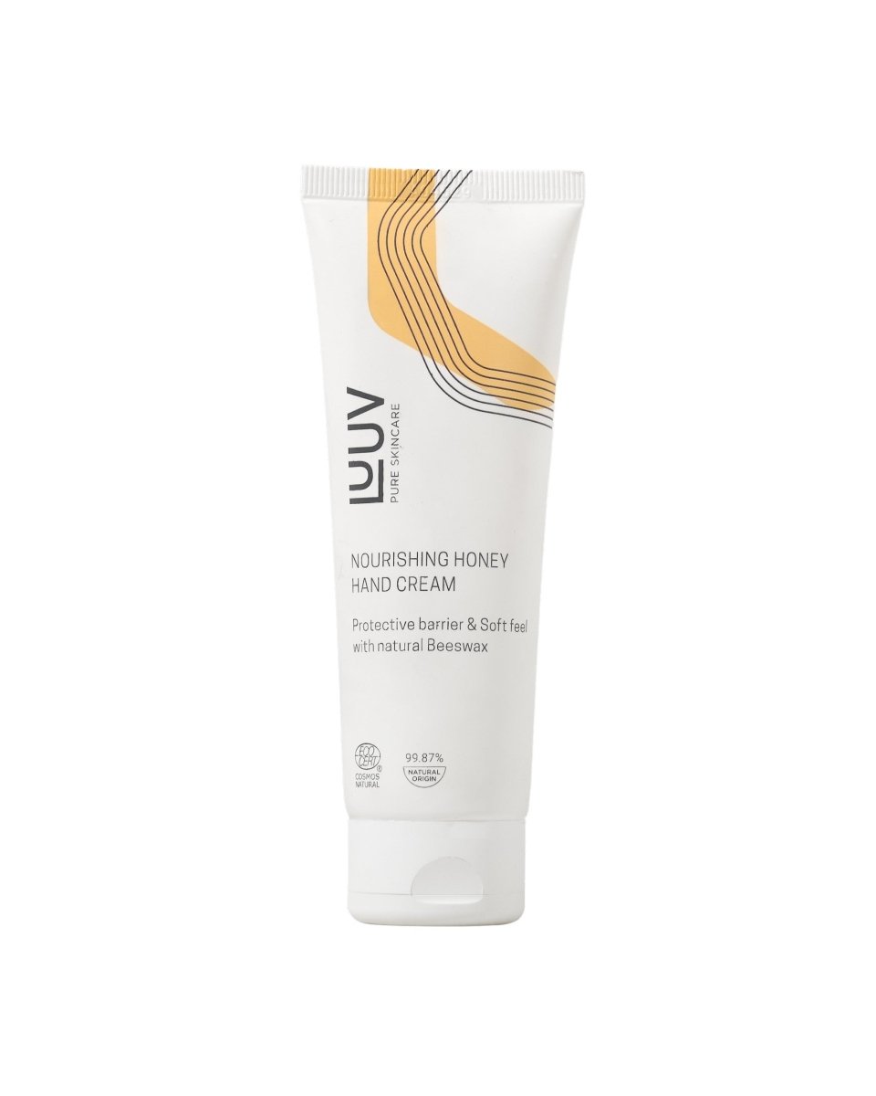 Vit tub med närande handkräm med honung, elegant guldgul design och COSMOS-certifiering, 70ml från LUUV