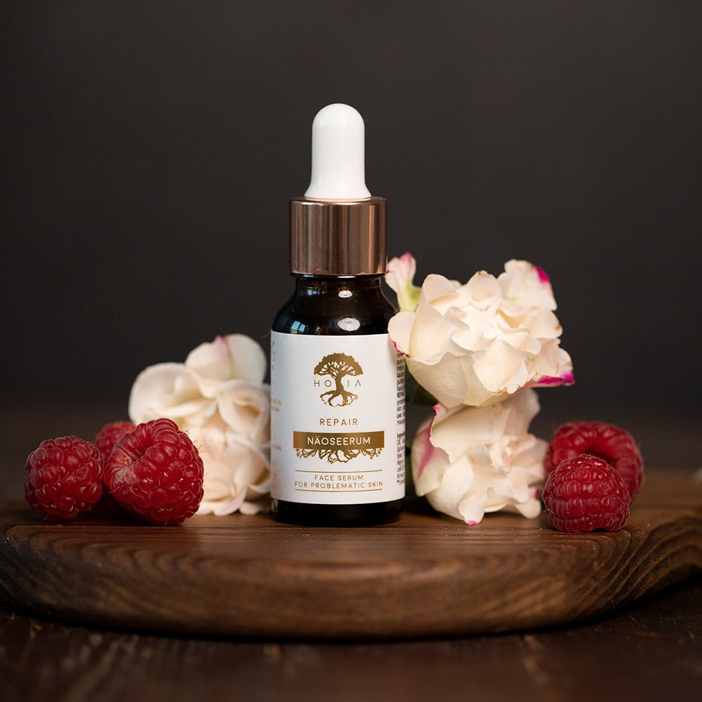 HOIA Face Serum Repair - naturligt ansiktsserum för problemhy i glasflaska på neutral bakgrund